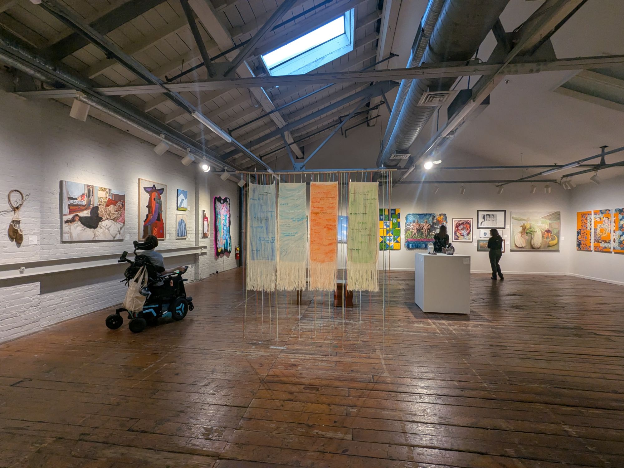 Members of Secular Women of the Triangle in an art gallery at ArtSpace. 
